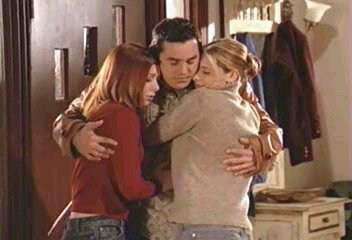 Willow, Xander and Buffy group hug just inside the Summers front door