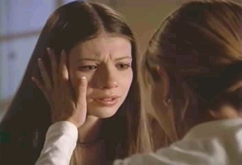 Buffy touches Dawn's hair/cheek