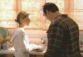 Buffy (with frying pan) and Xander in kitchen